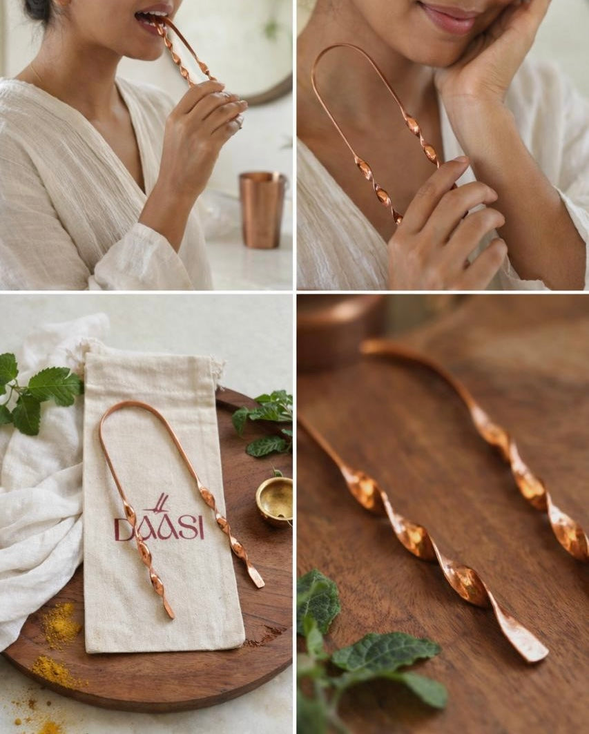 Jibbhi copper tongue cleaner in use, styled with its pouch and mint leaves